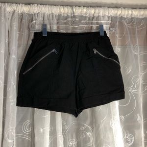 black shorts with zipper pockets on each side